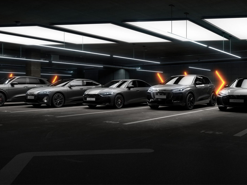 Audi models parked next to each other in parking garage